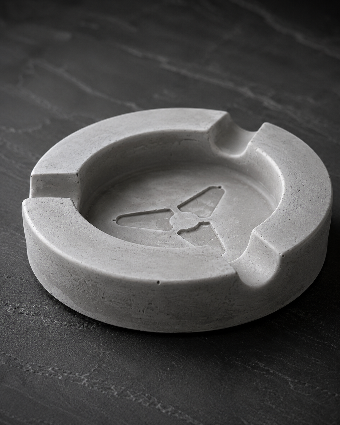 Detail view of ARUCOA handmade concrete cigar ashtray